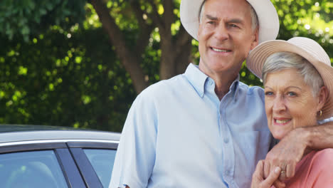 Happy-senior-couple-standing-in-park