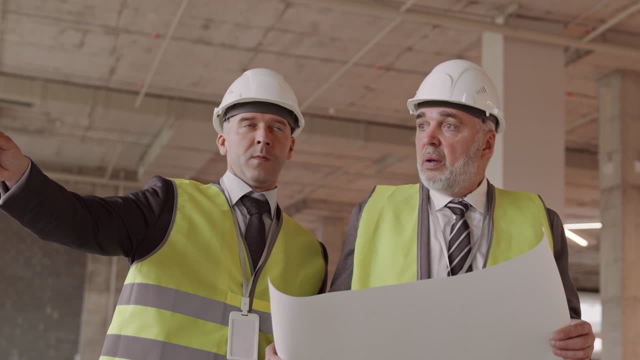 Caucasian Businessmen Supervising Construction Site