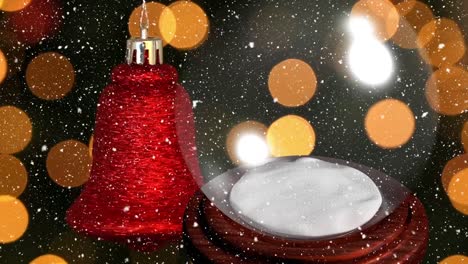 Animation-of-christmas-ball-and-glass-ball-over-snow-falling-and-bokeh