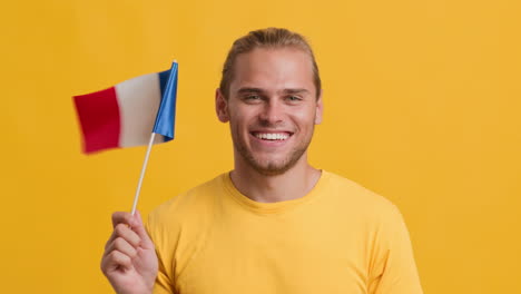 man holding french flag