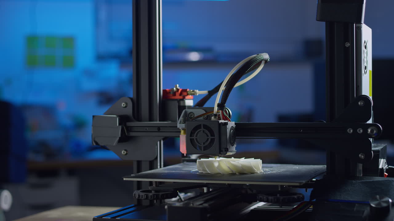 A 3d printer uses additive manufacturing to create a prototype in a clean workspace the process
