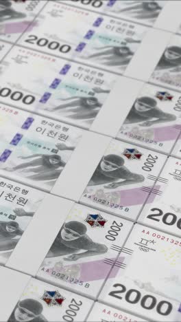 video vertical de billetes de 2000 won surcoreanos impresos por una imprenta de dinero
