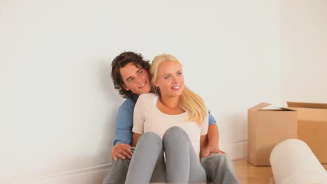 Couple-enjoying-being-in-their-new-livingroom