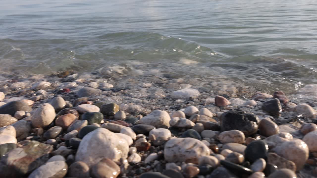 Pebble beach with gentle waves