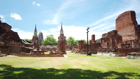 pan shot: ruins of ancient buddhist temple at the old the historic city of ayutthaya thailand