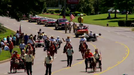 a shriner's parade features horses and small cars