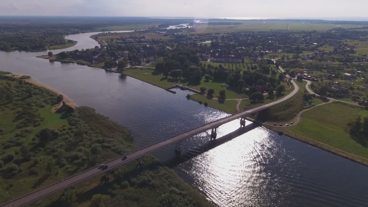 Atmata River and The Bridge to Rusne. Aerial Flying Backwards