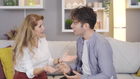 stressed young man talking to his mother and is angry.