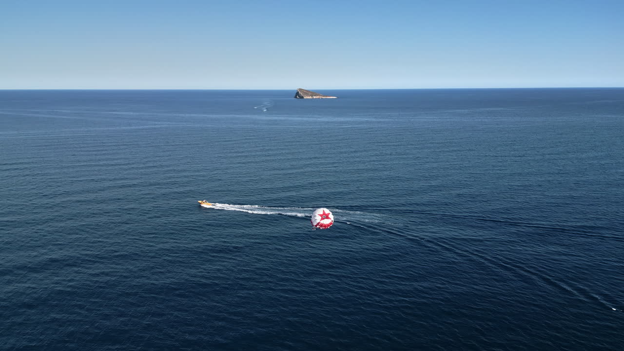People parasailing on the Mediterranean Sea in Benidorm, Spain