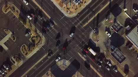 drone flying overhead of a busy intersection in the evening