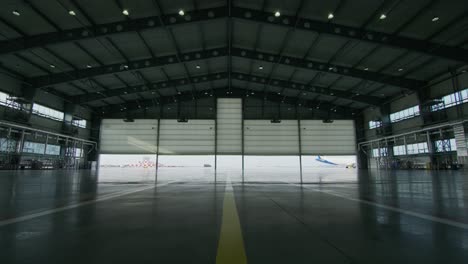 empty airport hangar with airplane