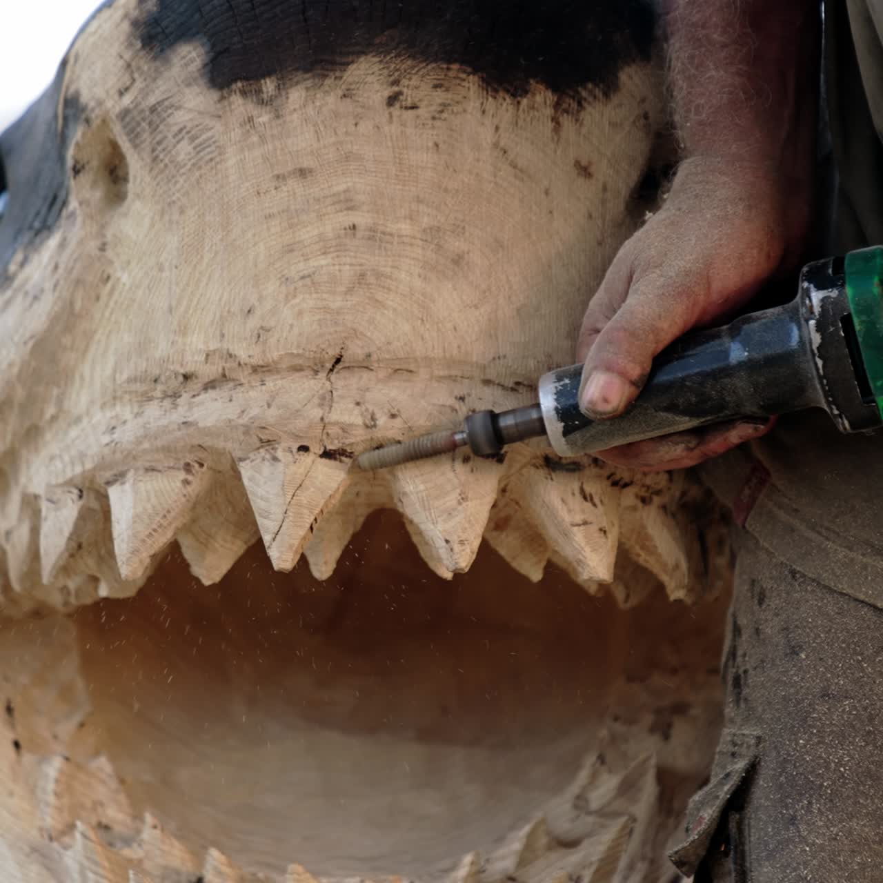 Wooden sculpture artist making. Craftsman cutting the wood for decoration