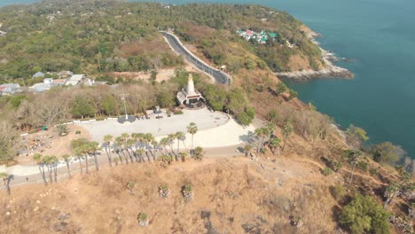 temple shrine of lord brahma and light house in promthep cape in phuket, thailand - aerial panoramic wide shot