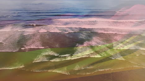composición digital de agitar la bandera de alemania contra la vista aérea de las olas del mar