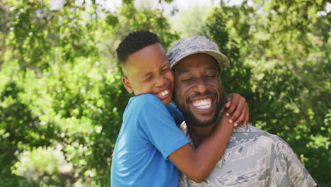 father hugging his son