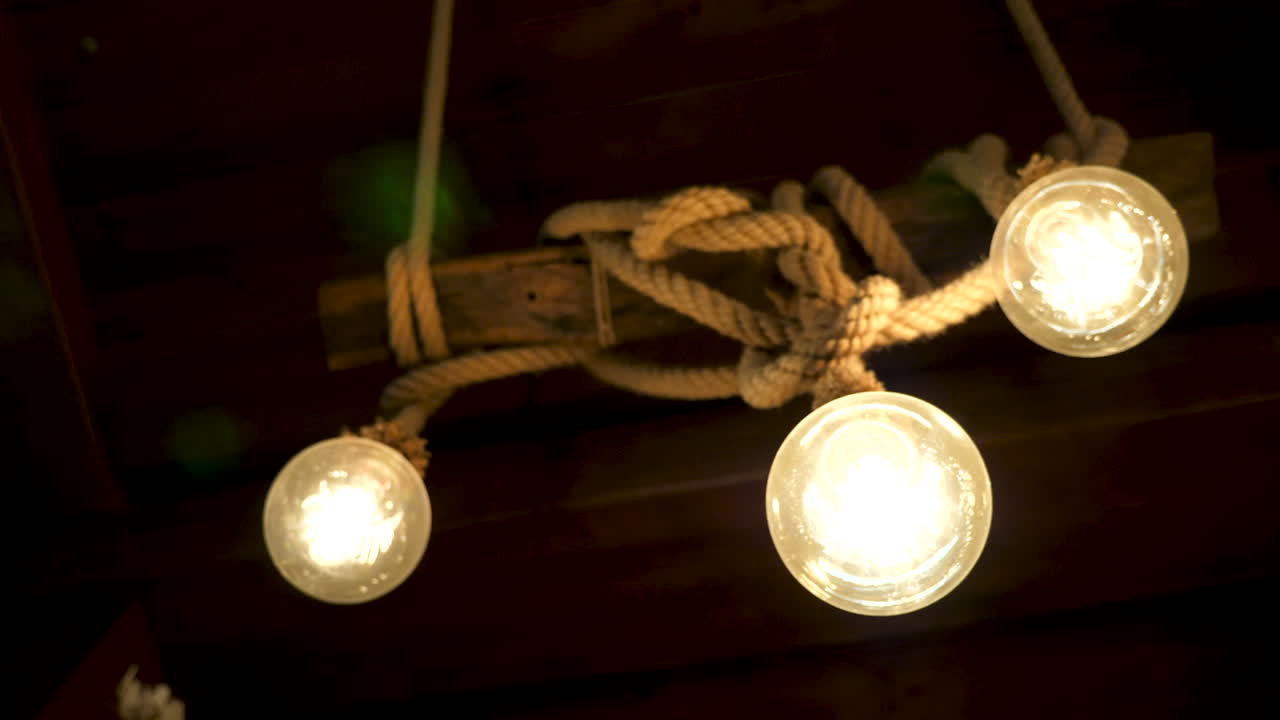 Zoom in on light bulbs against a black background