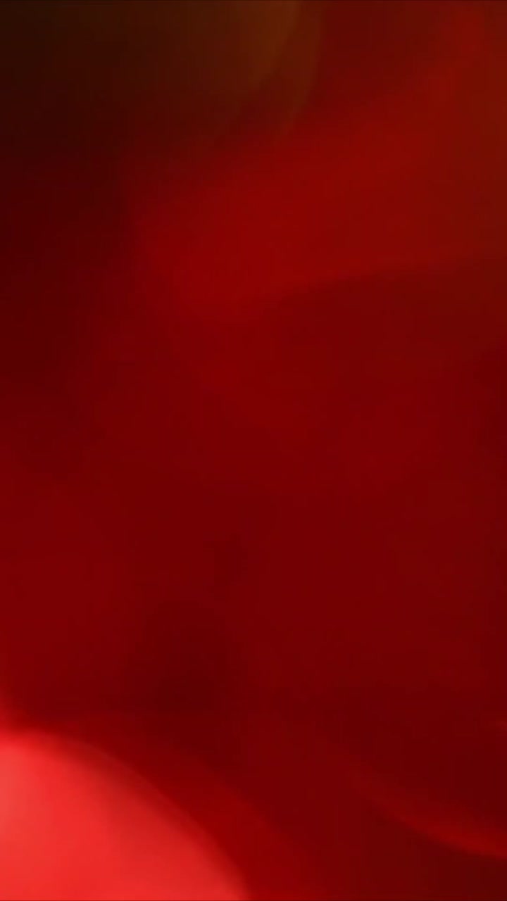 Sfondo dinamico con effetti luce bokeh rossi e gialli