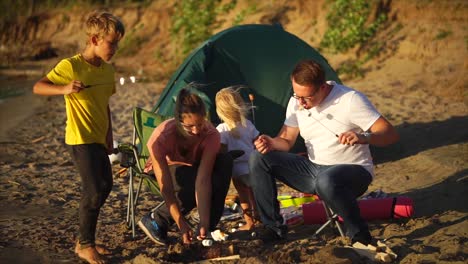 family camping trip by the river