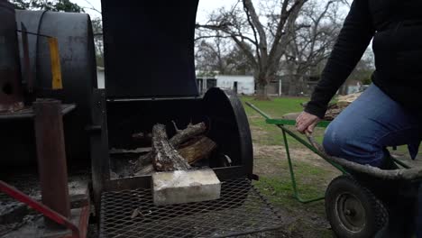 A person breaks a stick for fire wood