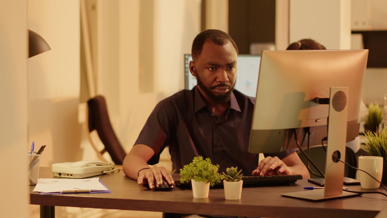 Man Working on Computer in Office