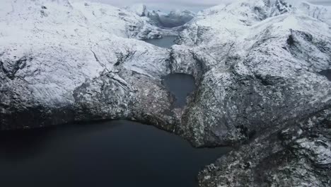 Rocky-mountains-covered-with-snow-in-volcanic-terrain-on-winter-day