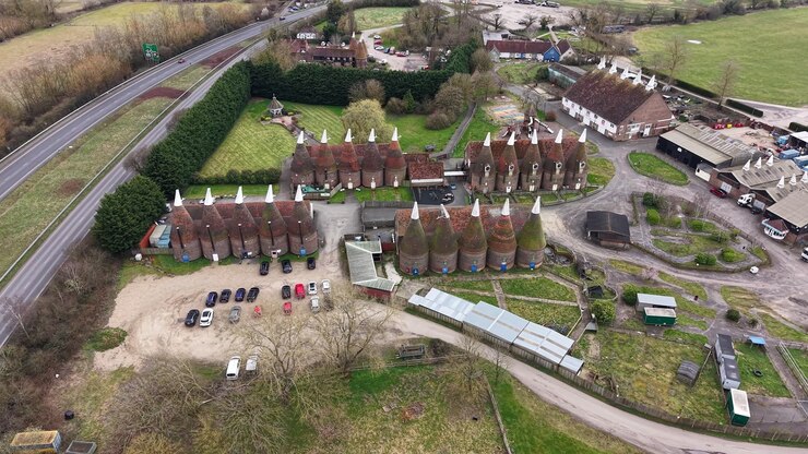 Hop farm in Tonbridge Kent aerial view over rustic English oast houses and rural brewery estate