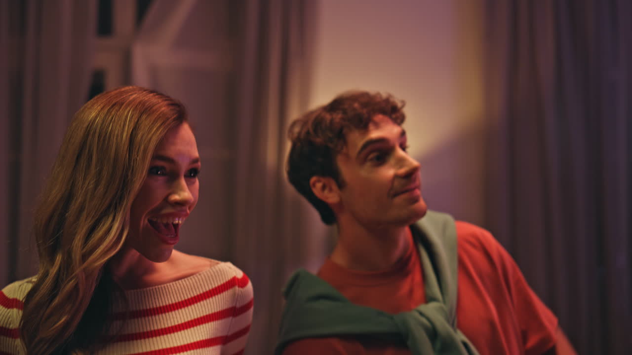 Excited friends hug greeting on home party close up. Happy mates enjoy gathering