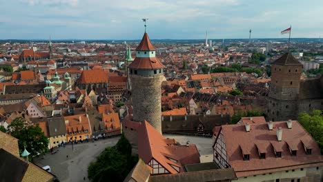 4k aerial drone video of the imperial castle with the st. sebald church in the distance in downtown nurnberg, germany
