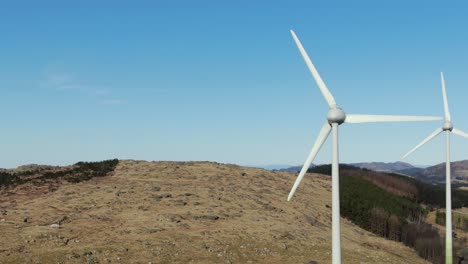 Aerial-view-of-windturbines-in-a-scenic-coastal-landscape-of-Norway,-alternative-energy-concept,-revealing-drone-shot