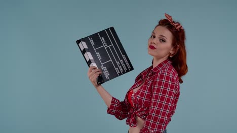 pin-up girl with clapperboard