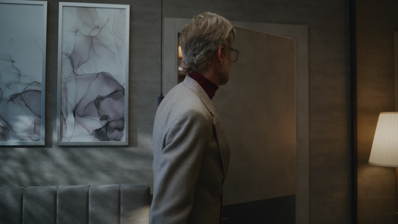 Stylish Man in Good Mood Enters Modern Hotel Room (Stock Footage)