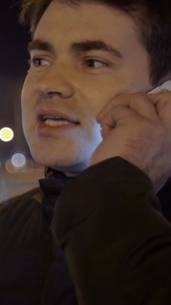 Man on a phone call at night