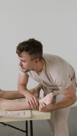 therapist performing foot and ankle physiotherapy