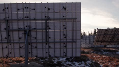 drone view solar panel from behind sun peeking