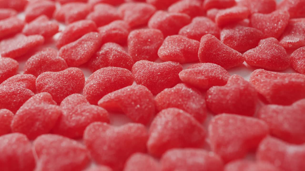 Heart shape sweets on pink background at valentine's day