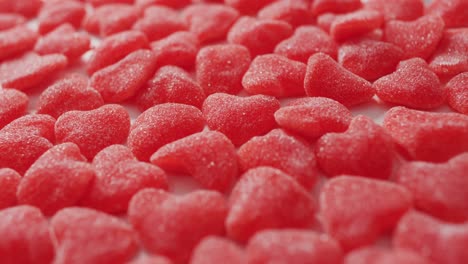 heart shape sweets on pink background at valentine's day