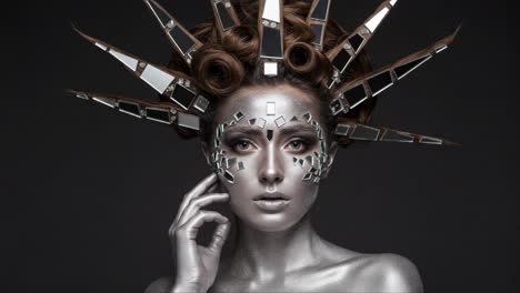 a striking and artistic portrayal of a silver-themed model embellished with reflective mirror elements and intricate hairstyle, capturing a captivating and futuristic aesthetic