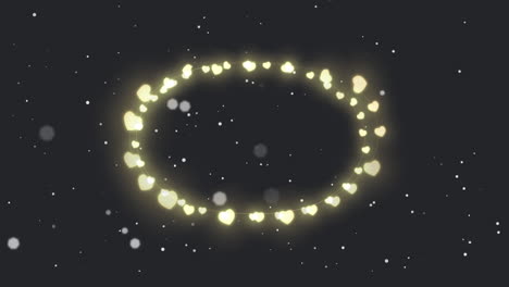 animation of circle of glowing heart christmas fairy lights over falling snow, on black