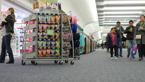 people walking in an airport.