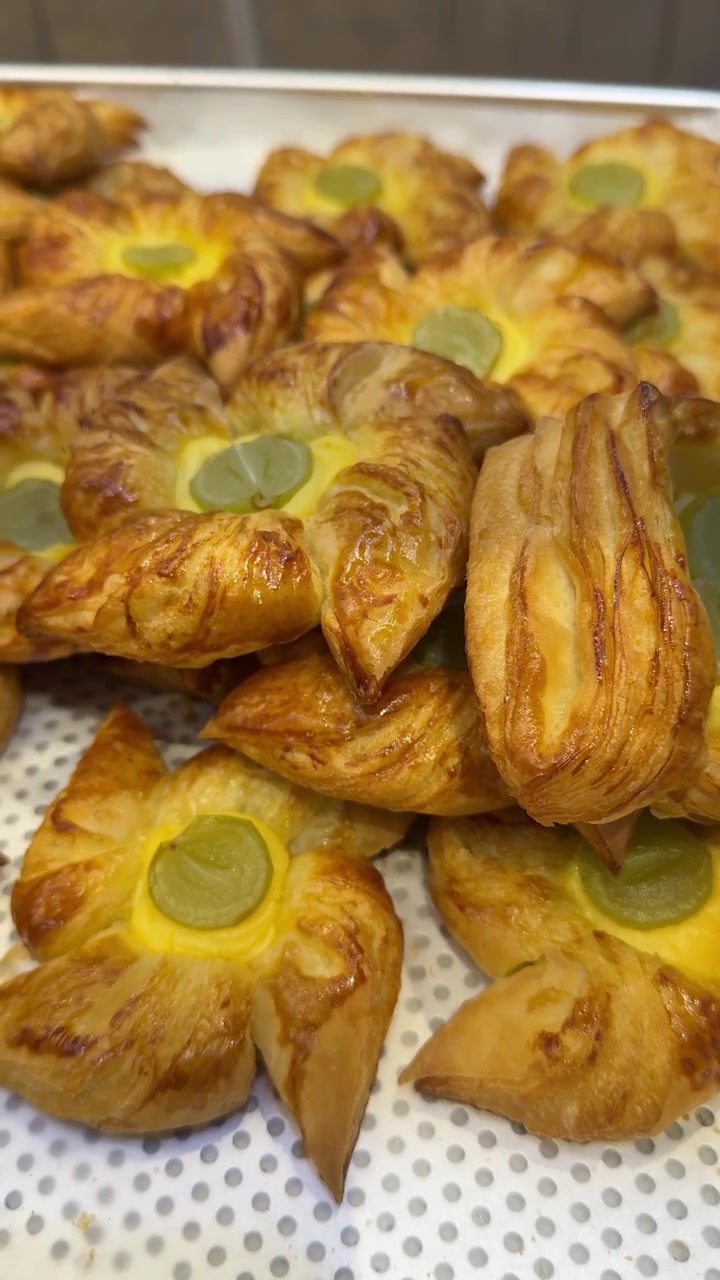 Freshly Baked Danish Pastries with Custard and Grapes on a Tray
