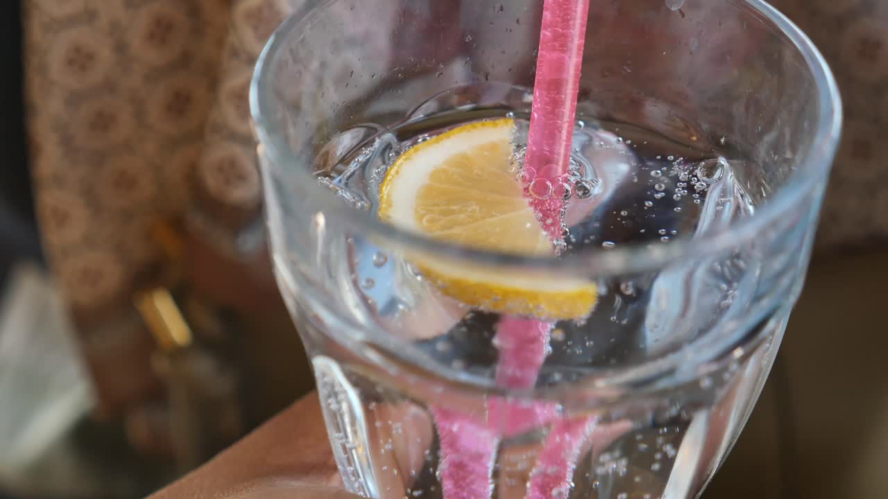 Refreshing Lemon Drink with Pink Straw