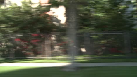 a car travels along a street in century city los angeles as seen through the side window 4