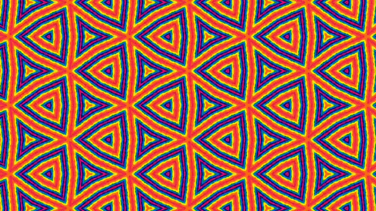 animación de hexágonos coloridos dispuestos simétricamente, girando y cambiando de forma, aislados en fondo naranja