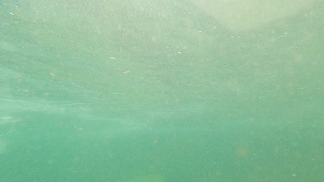 man swimming in mountain river blue clear water at day