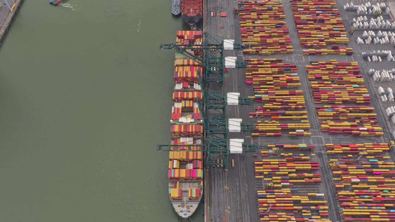 Drone top view of Antwerp port logistics with cranes and vessels, Belgium