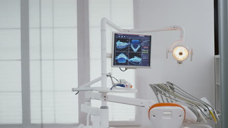 close up of medical orthodontist display with teeth x ray images on it