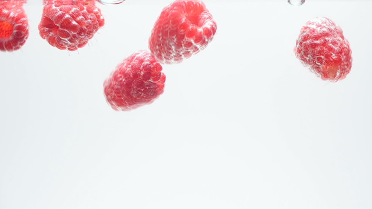 Raspberry on a white background. Shooting on a white background
