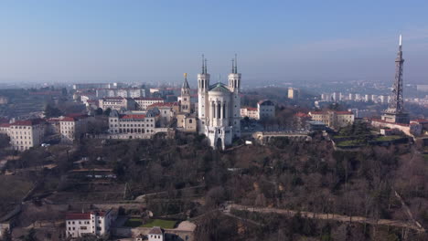 Aerial-flying-towards-Notre-Dame-de-Fourviere,-Lyon,-France