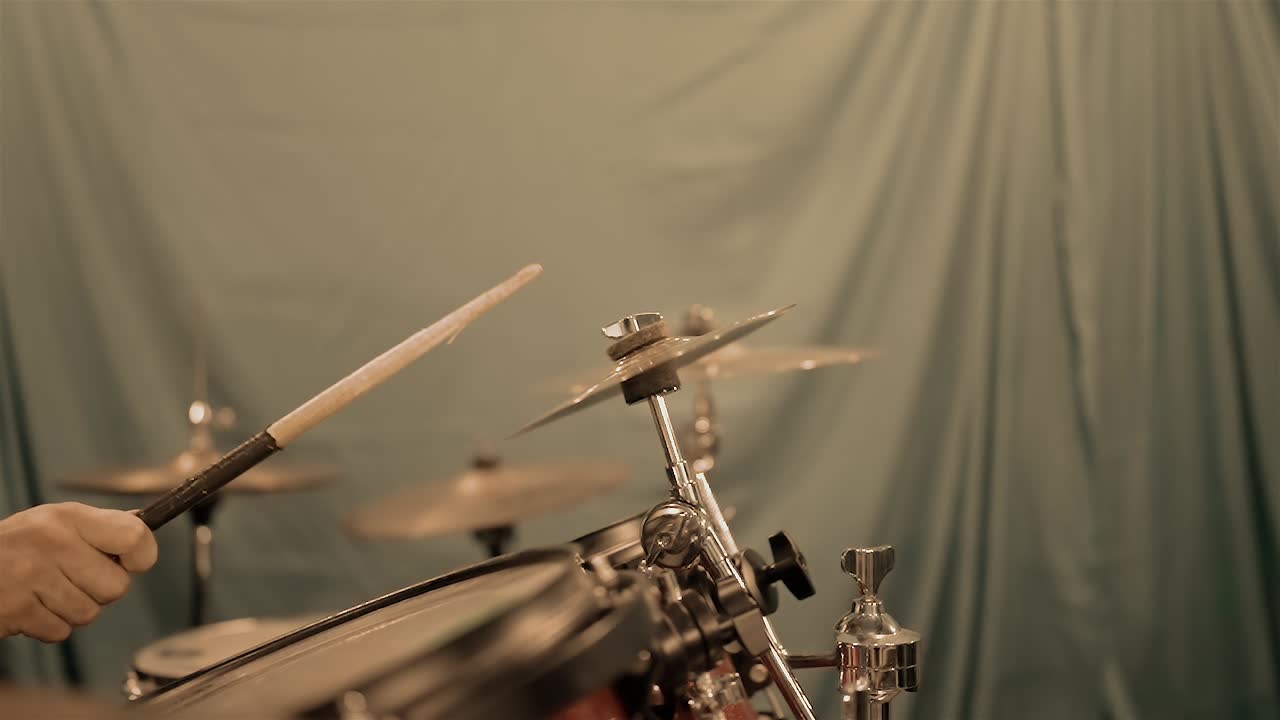 Drummer Hitting a Cymbal on a Drum Kit