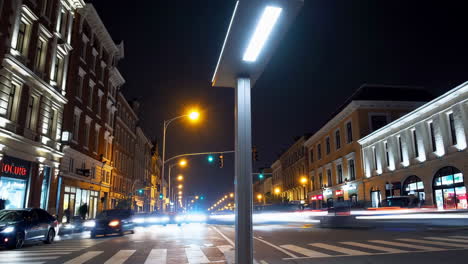 nighttime city street with light trails and modern urban lighting